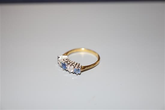 A sapphire and diamond five-stone half-hoop ring, 18ct gold setting, size O, gross weight 3.7 grams.